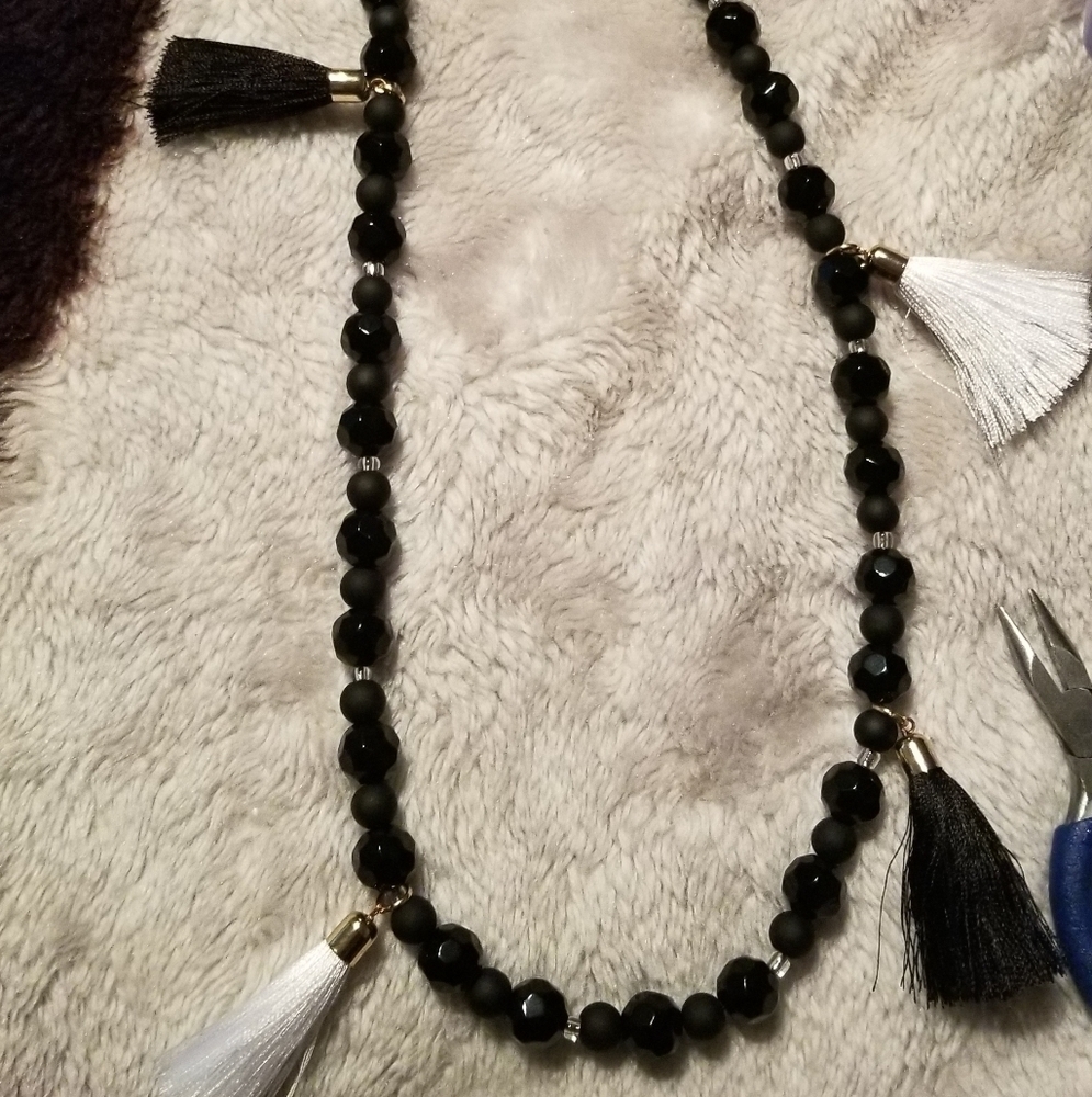 Black, white tasseled necklace with matte black & glossy black beads.